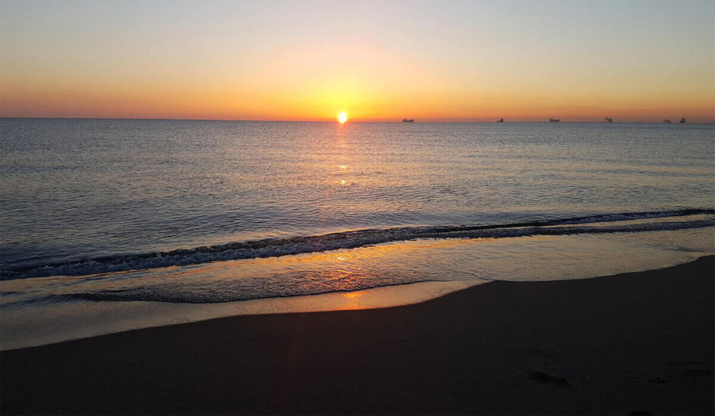 Orange sunrise at Levante beach, La Linea