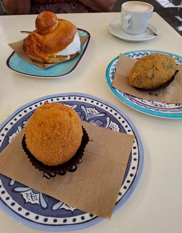 Arancini at Teatro Bellini piazza , Catania